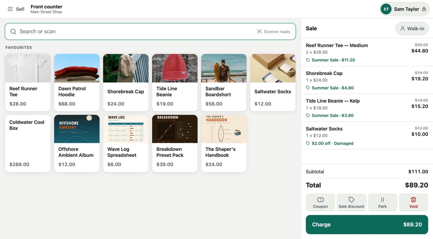 The till's Sell screen: a search bar, a grid of favourite products with pictures, and a sale of two tees, a cap, a beanie and socks coming to $89.20